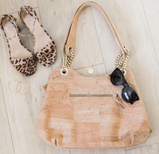 Made from 100% natural cork, the Lisboa Bag enhances any to-and-from look. Complete with a gold chain for an extra dress-y appeal and short shoulder straps, this bag is versatile to carry as a hand or shoulder bag. With two pockets on the inside, one open and one zipper compartment, and one zipper pocket on the outside, the Lisboa bag is the only purse you need.
CORC YOGA. Handcrafted Luxury Rooted in Nature
https://corcyoga.com/product-category/bags/ 
#CorcYoga #Wellness #FamilyHealth #SustainableLuxury #Yoga #CorkTrees #CorkIsFun #Sustainability #WellnessInHospitality #EthicalTravel #CorcYogaMoments